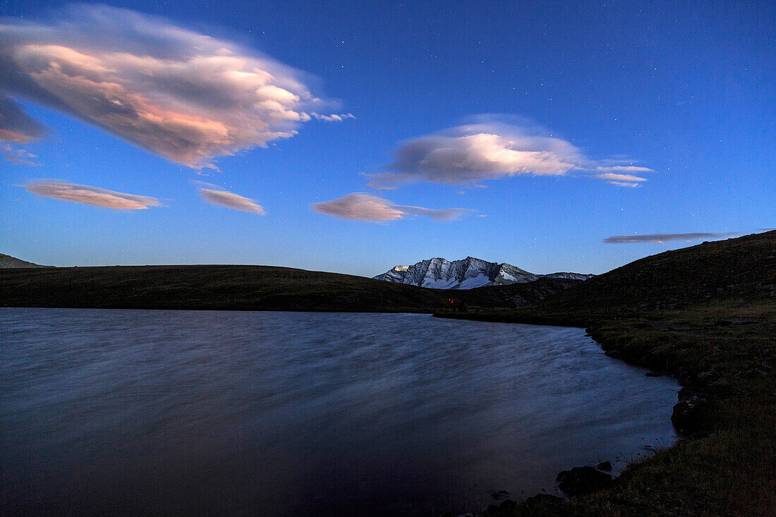 Pink clouds after sunset on Rossett Lake at an altitude of 2709 meters, Gran Paradiso National Park, Alpi Graie (Graian Alps), Italy, Europe