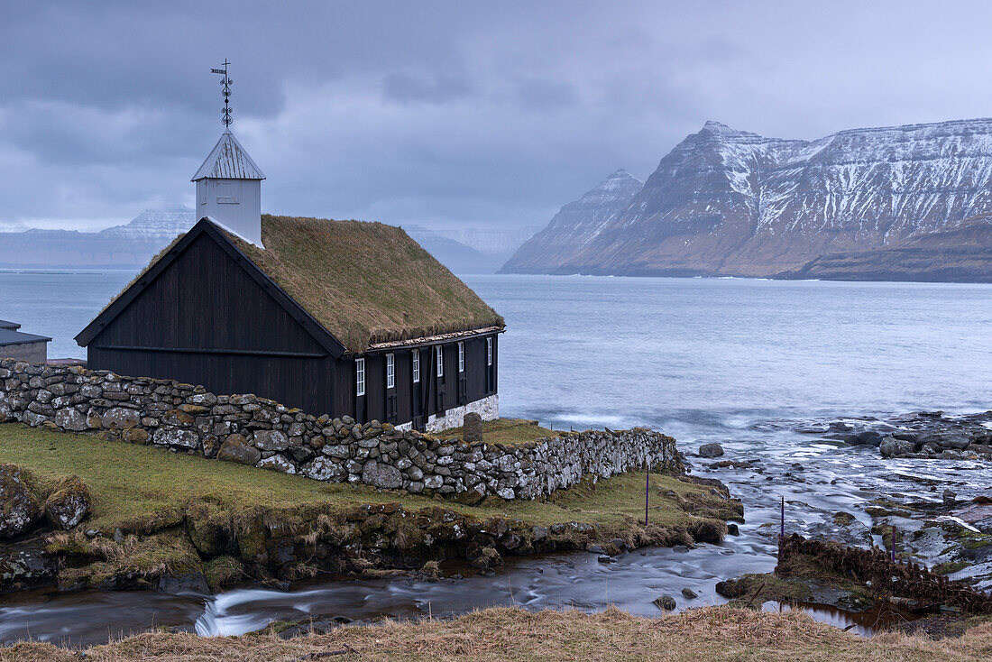 Grass roofed Church in the village of Funningur in winter on the island of Eysturoy, Faroe Islands, Denmark, Europe