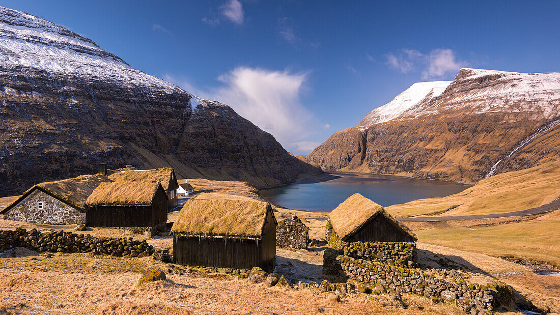 The ancient village of Saksun surrounded by beautiful mountain scenery, Streymoy, Faroe Islands, Denmark, Europe