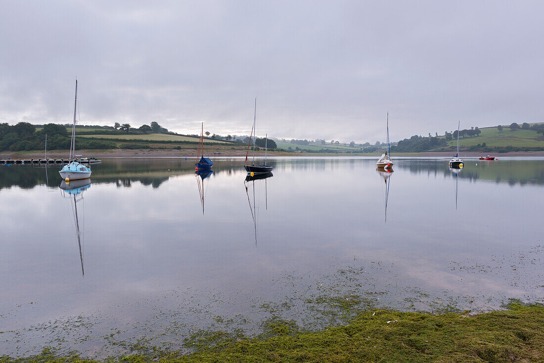 Yachts in Wimbleball lake on a misty morning, Exmoor National Park, Somerset, England, United Kingdom, Europe