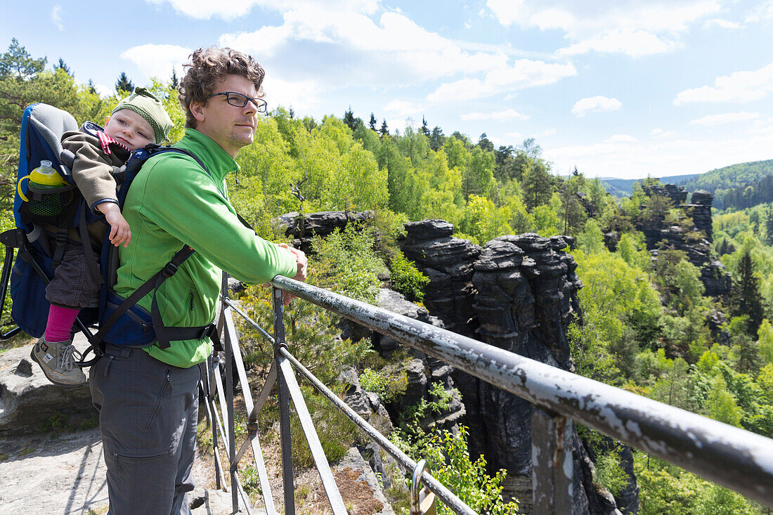 Father with baby carrier backpack, Saxony Switzerland, hiking day, family trip, Elbe sandstone mountains, MR, Dresden, Saxony, Germany, Europe
