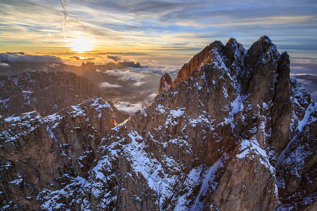 Aerial shot of Sassolungo at sunset, Sella Group, Val Gardena in the Dolomites, Val Funes, Trentino-Alto Adige South Tyrol, Italy, Europe