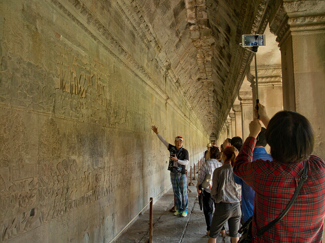 Guide with tourists at the Angkor Wat Archaeological Park, UNESCO World Heritage Site, Siem Reap, Cambodia, Indochina, Southeast Asia, Asia