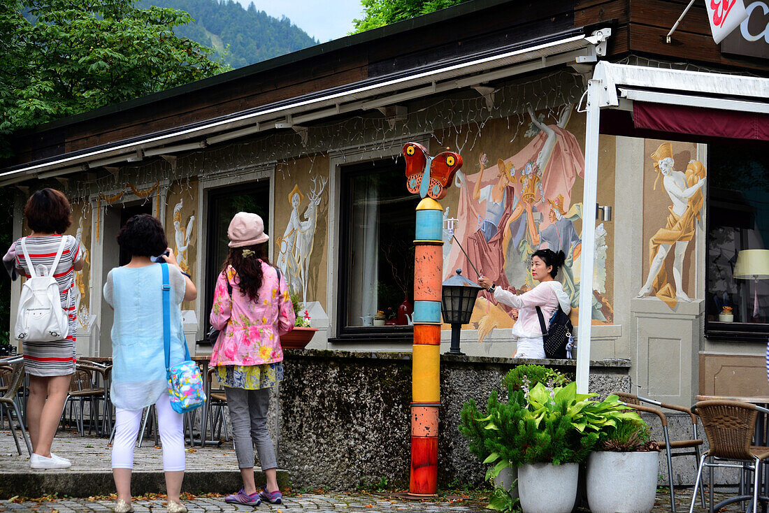 Asian tourists in Oberammergau, Upper Bavaria, Bavaria, Germany