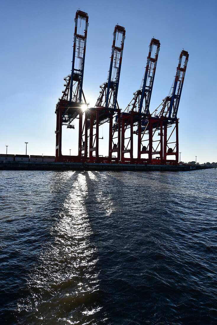 Cranes for loading containers at the harbour, Hamburg, Germany