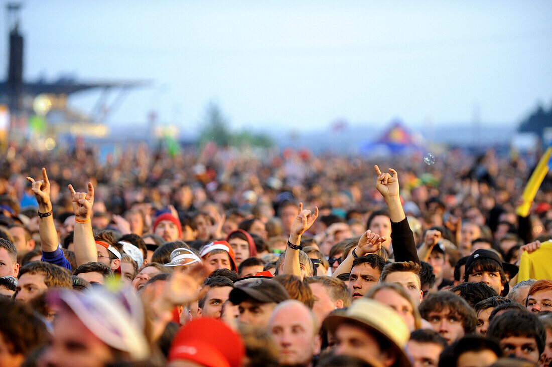 Cheering fans at rock concert outside,Germany