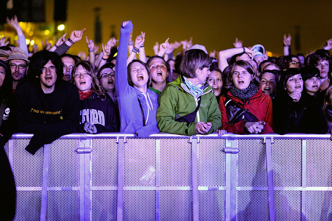 cheering fans at a rock concert outside, Rock am Ring, Nuerburgring, Nuerburg, Germany