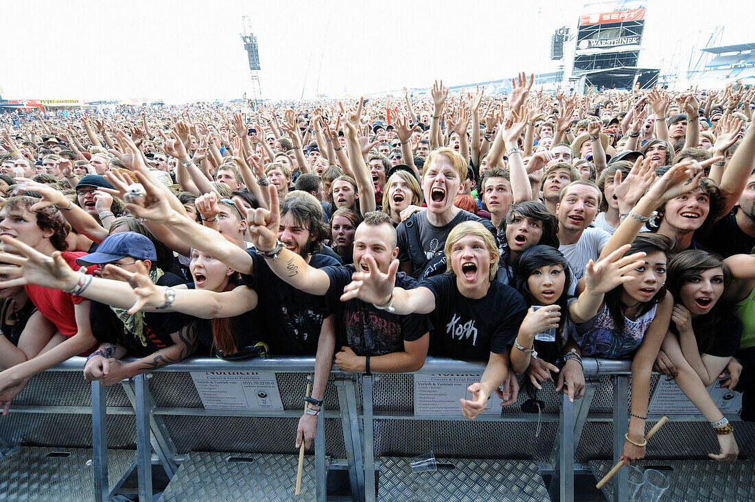 cheering fans at an outdoor rock concert,Germany