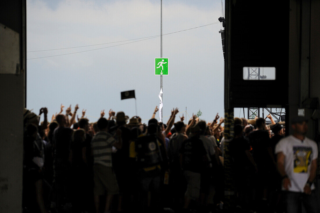 cheering fans at an outdoor rock concert,Germany