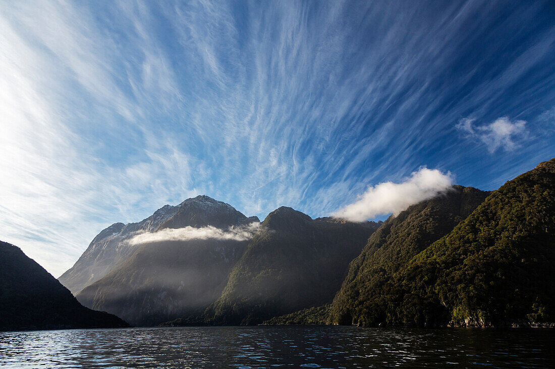 Forested mountains over remote river, Te Anau, Southland, New Zealand