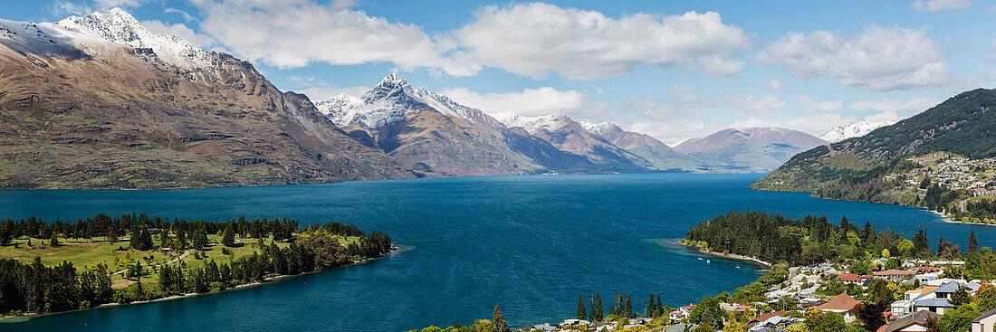 Snowcapped mountains and town near lake, Queenstown, Central Otago, New Zealand