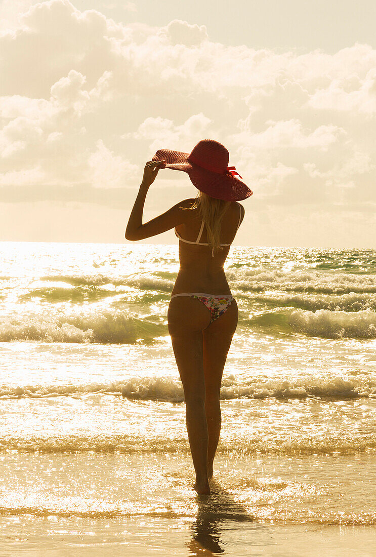Caucasian woman standing on beach