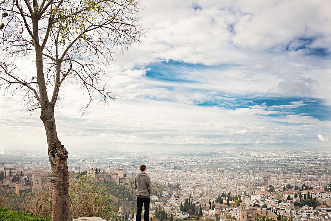 Man admiring scenic view of cityscape, Granada, Spain