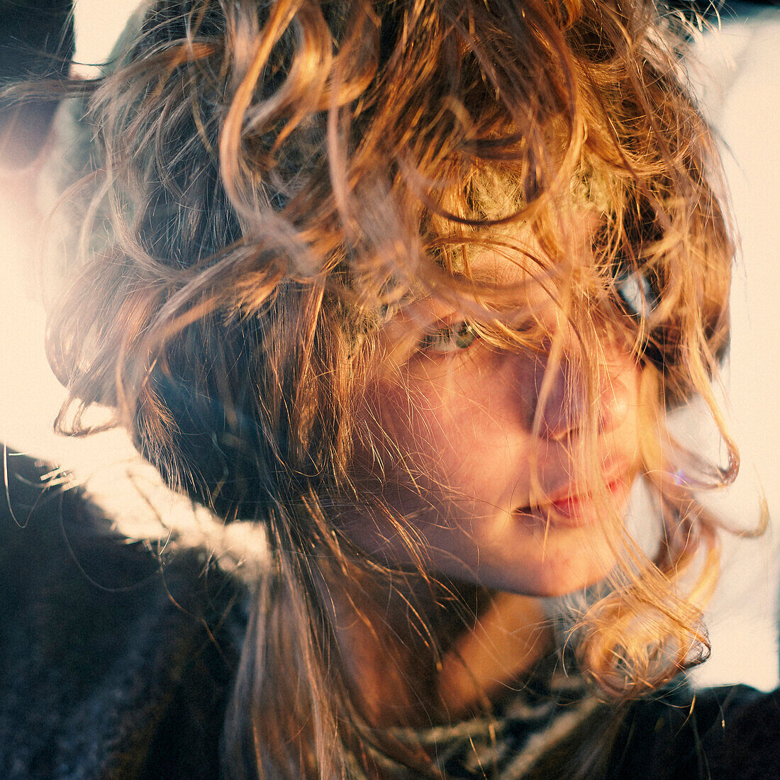 Close up of Caucasian girl with messy curly hair