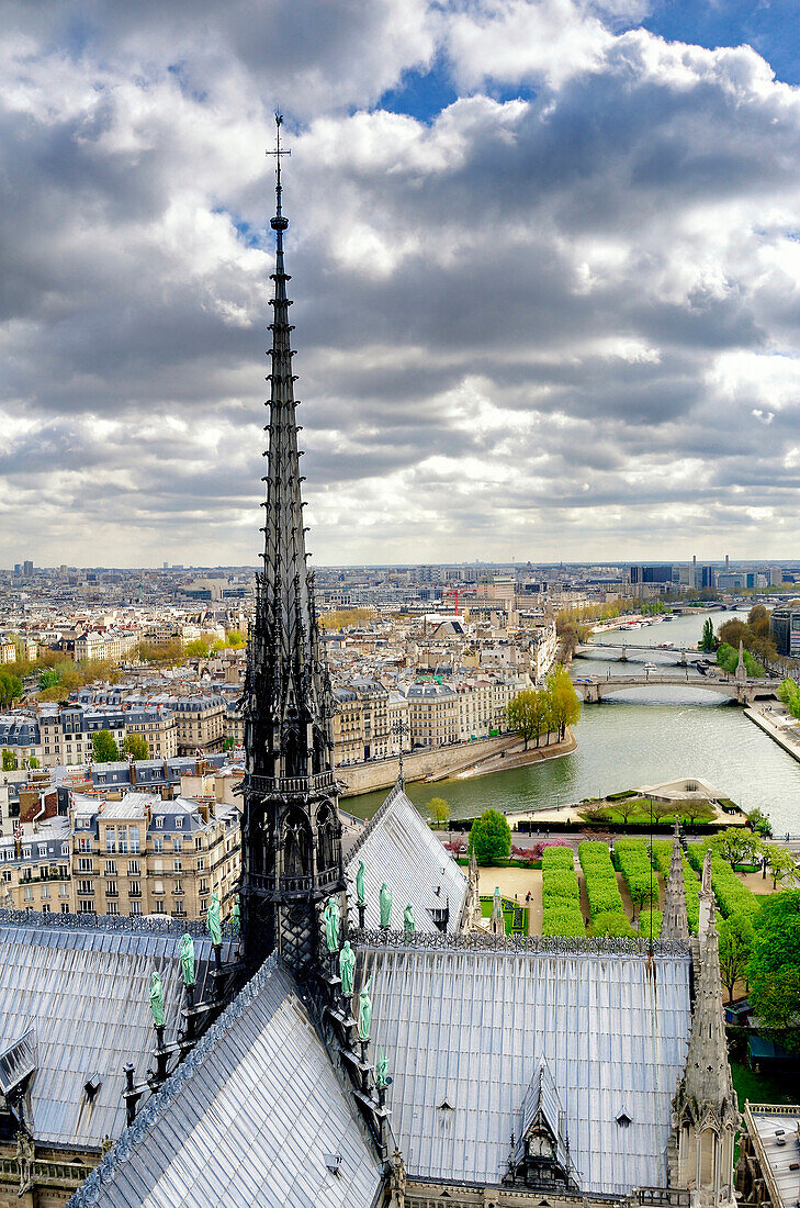 Notre Dame spire over Paris cityscape, Ile-de-France, France