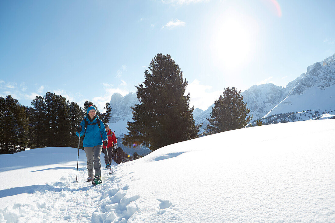 Group of people snow shoeing, Kreuzwiesenalm, Luesen, South Tyrol, Italy