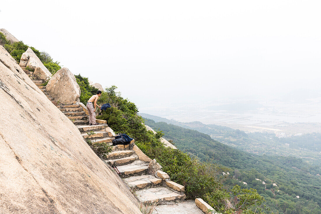 Sport climbing near Xiamen, rock climbing, young man, climbing area Nantaiwu, granite rock, Xiamen, Fujian, China, Asia