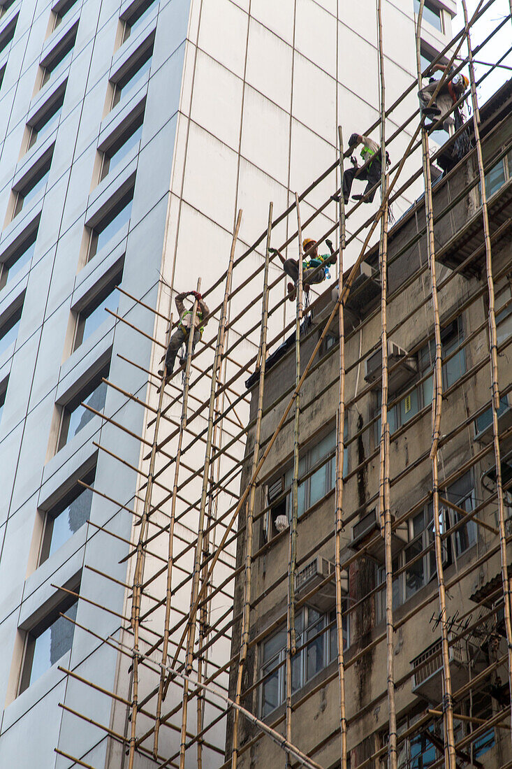 workers, acrobatic, Bamboo scaffolding, contrast, old and new, work safety, construction site, residential flats, housing, Hong Kong, China, Asia