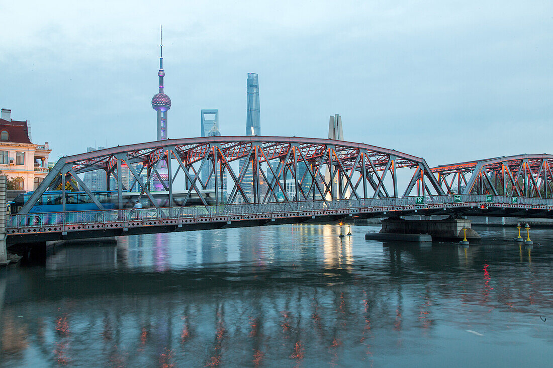 historic Waibaidu steel bridge crosses Suzhou Creek, Pudong skyline in background, Shanghai, China, Asia