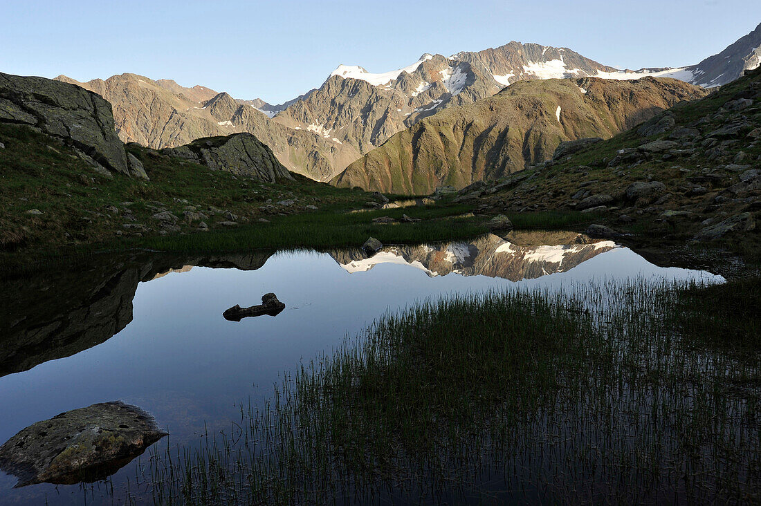 Small lake in the Stubai Valley with reflection, Tyrol, Austria