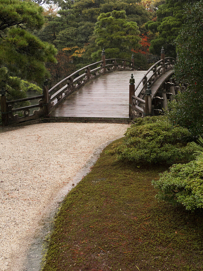 Ancient Japanese stone bridge in Imperial park, Kyoto, Japan