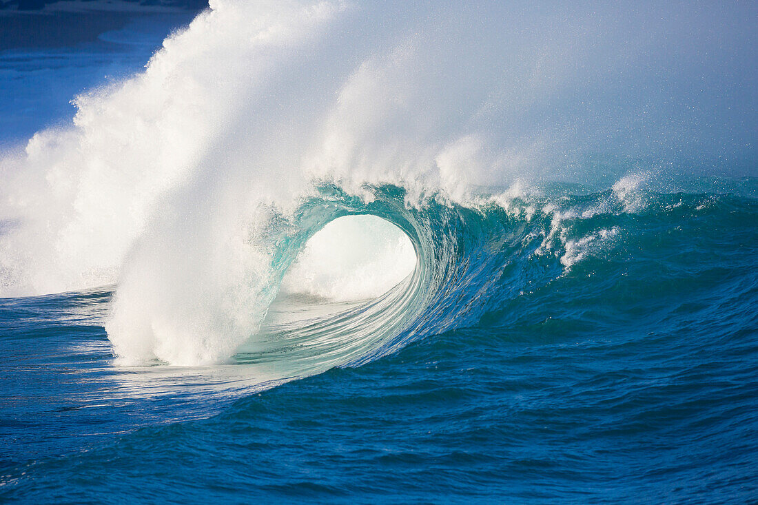 Waves breaking at Waimea Bay on the North shore of Oahu, Oahu, Hawaii, United States of America