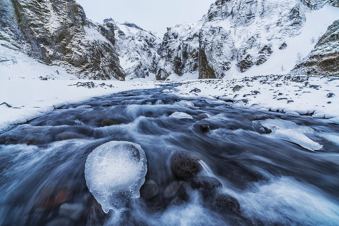 A river flows out of the mountains in the area known as Thorsmork, Southern Iceland, Iceland