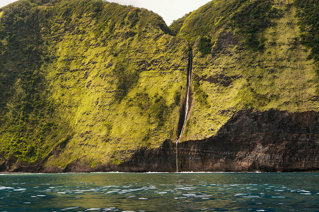Waterfall into ocean, Hamakua Coast, Island of Hawaii, Hawaii, United States of America