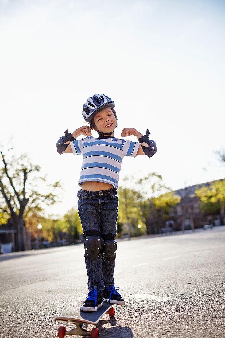 Young boy riding a skateboard, Montreal, Quebec, Canada