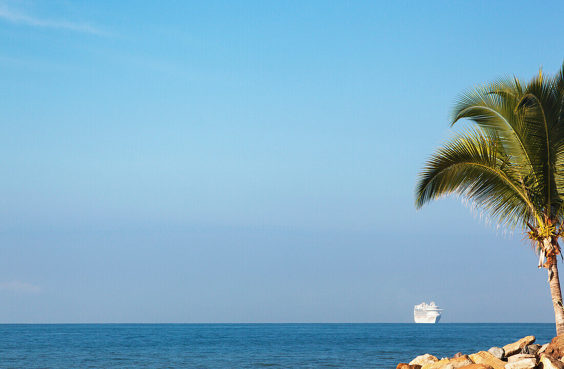 A cruise ship makes its way to port along the Mexican Riviera, Puerto Vallarta, Mexico