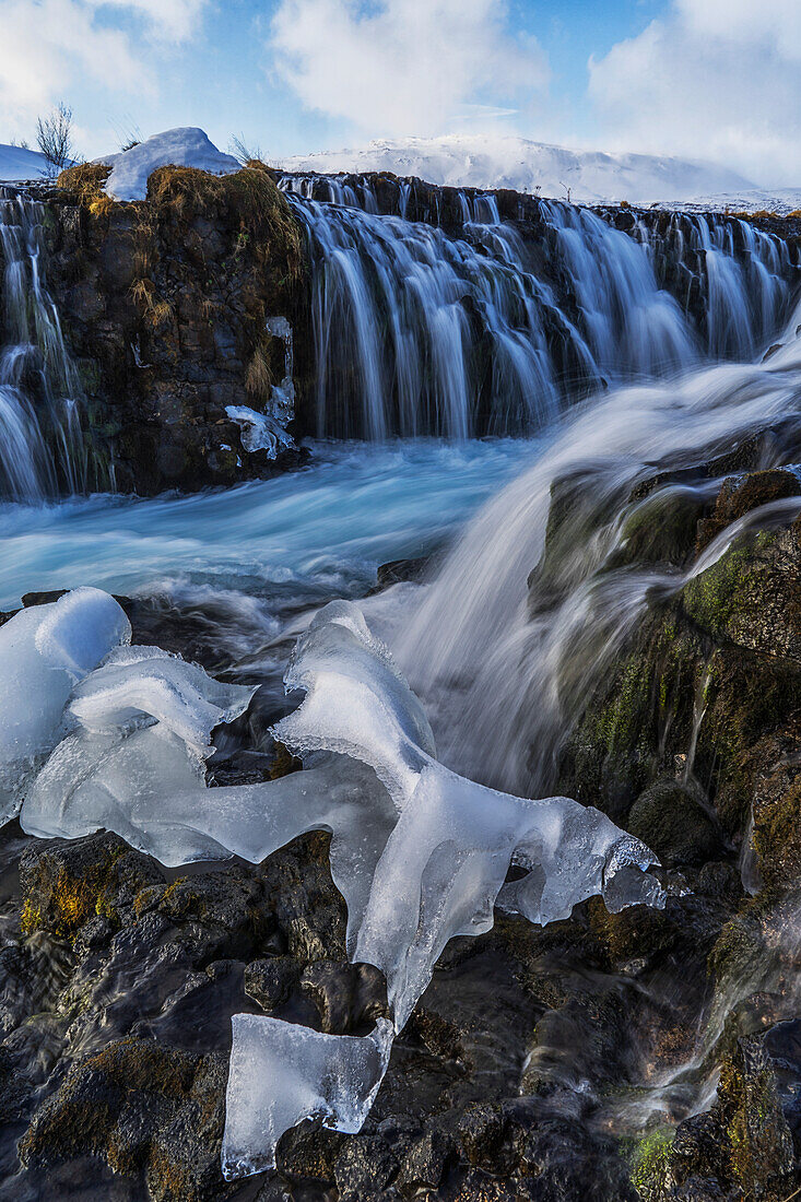Ice has been left behind after the Bruarfoss waterfall has melted, Iceland