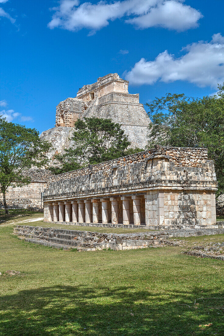 Columns Building in foreground with Pyramid of the Magician beyond, Uxmal, Mayan archaeological site, UNESCO World Heritage Site, Yucatan, Mexico, North America