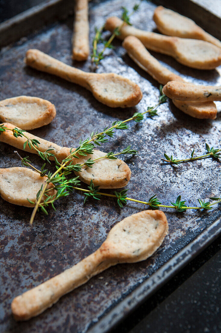 Parmesan Spoons with Rosemary on Baking Sheet