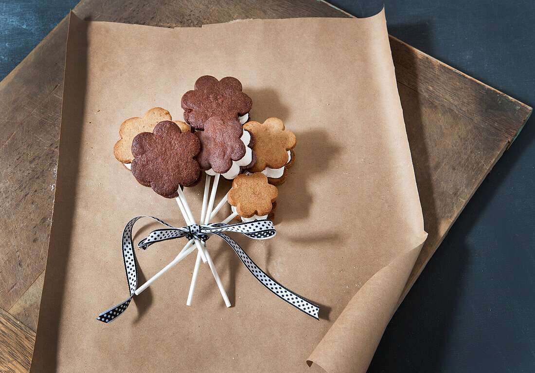 Flower-Shaped S'mores on Sticks Tied Together with Ribbon