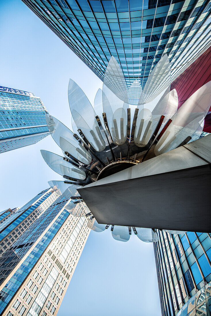 Glass and metal Lotus installation in front of HSBC Bank with surrounding new skyscrapers in Jianggan district, Hangzhou, Zhejiang, China, Asia