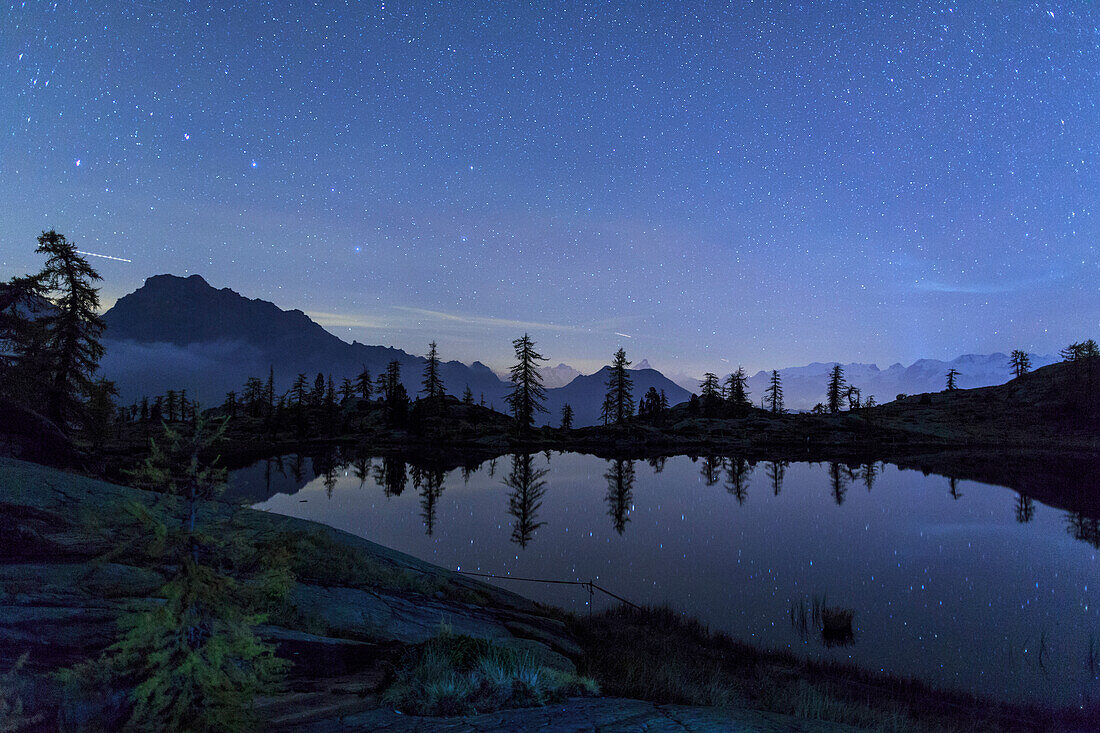 Starry night on Mount Rosa seen from Lake Vallette, Natural Park of Mont Avic, Valle d'Aosta, Graian Alps, Italy, Europe