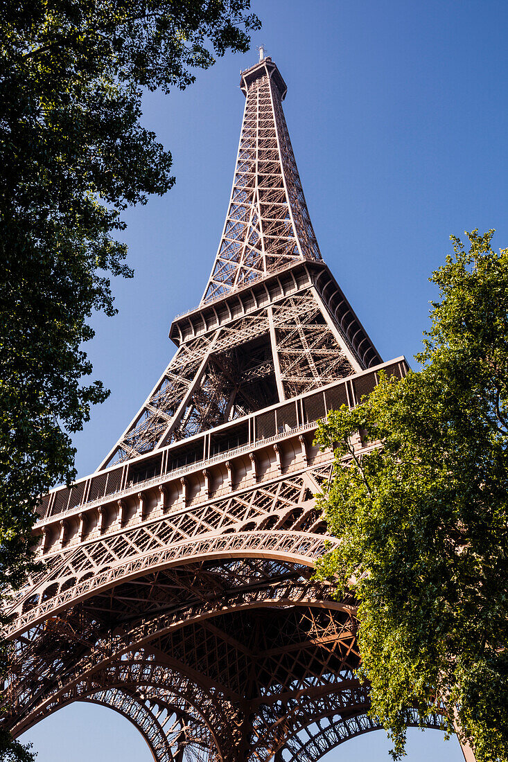 Looking up to the impressive Eiffel Tower in Paris, France, Europe