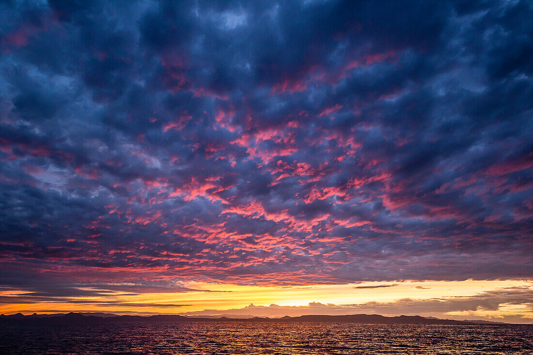 Intense clouds and sunset over Baja Peninsula from Isla Ildefonso, Baja California Sur, Mexico, North America
