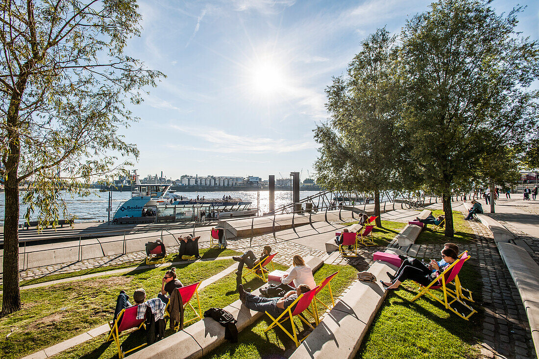 people chilling at the Dalmannkai in the Hafencity of Hamburg, north Germany, Germany
