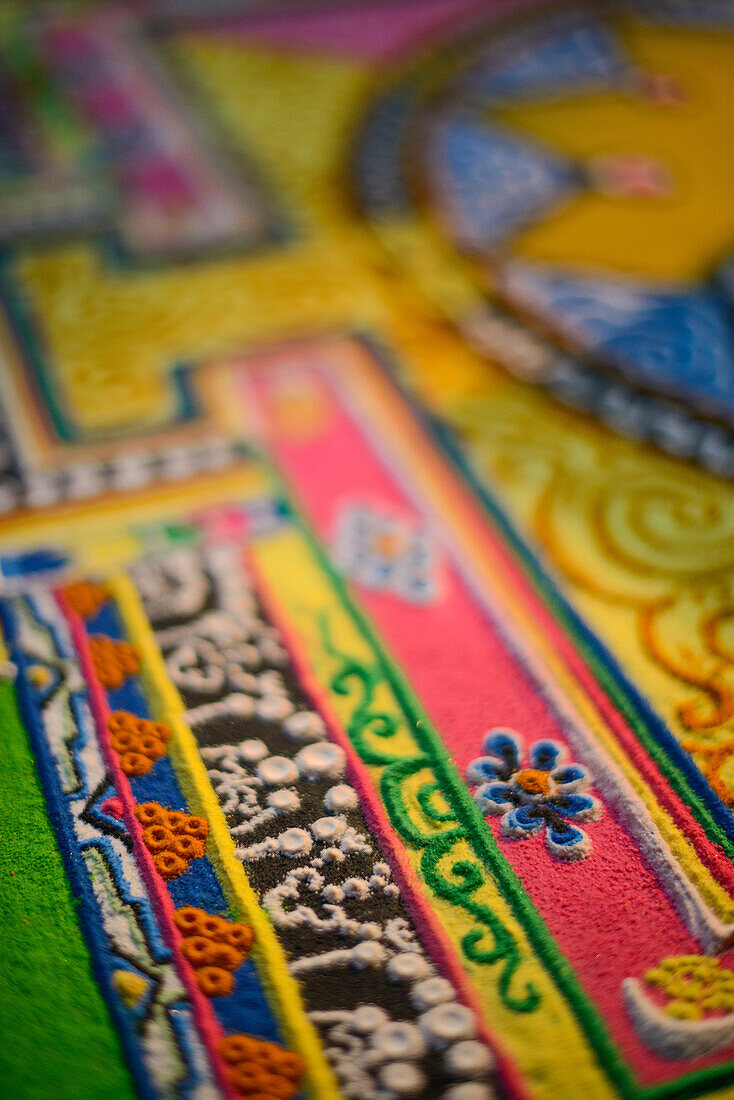 Buddhist monchs preparing a sand mandala with coloured wheat flour. The ceremony lasts for several days. Only very few visitors are granted entrance to this very seldom ceremony. Even less are allowed to take photographs. Lo Manthang (3840 m), former capi