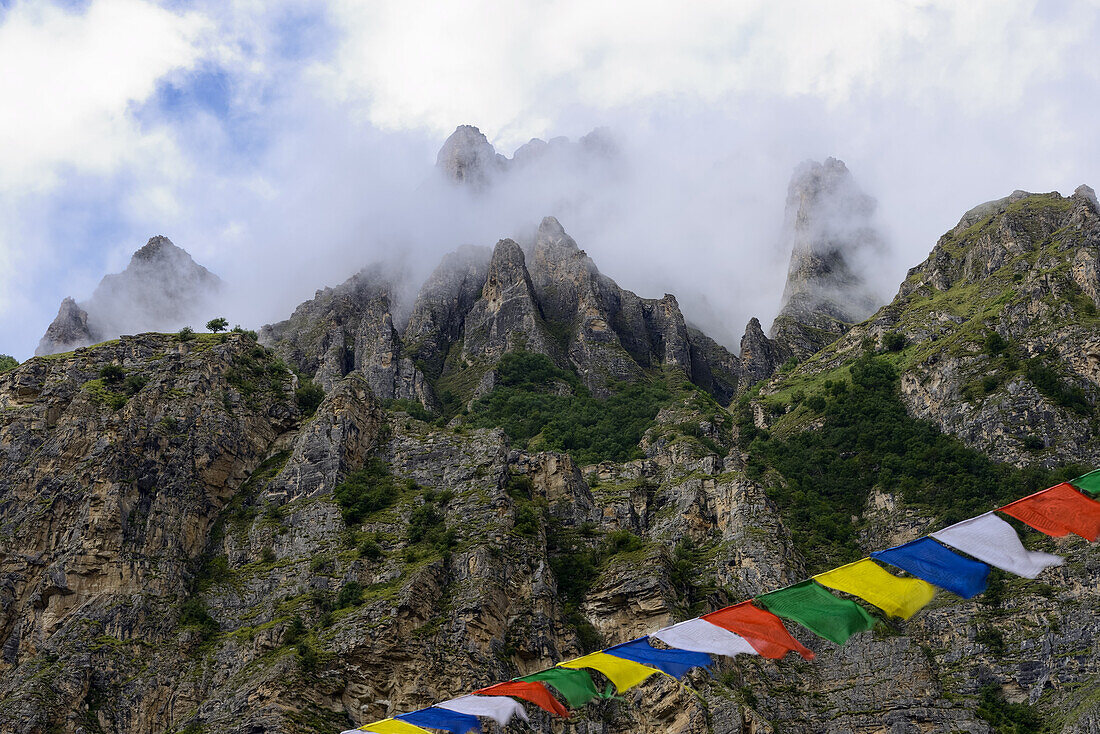 Prayer flags at the Buddhist gompa Yughat at the Nar Phu Trek between Meta and Nar, Nepal, Himalaya, Asia