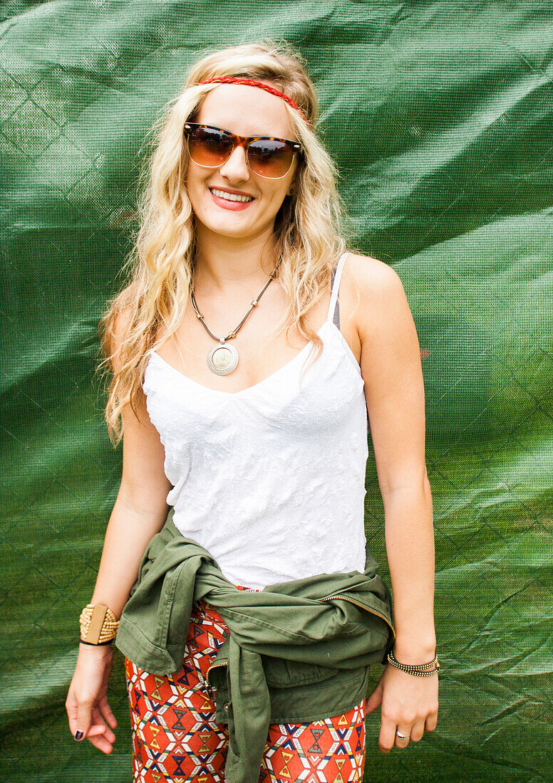 Caucasian woman smiling near tarp