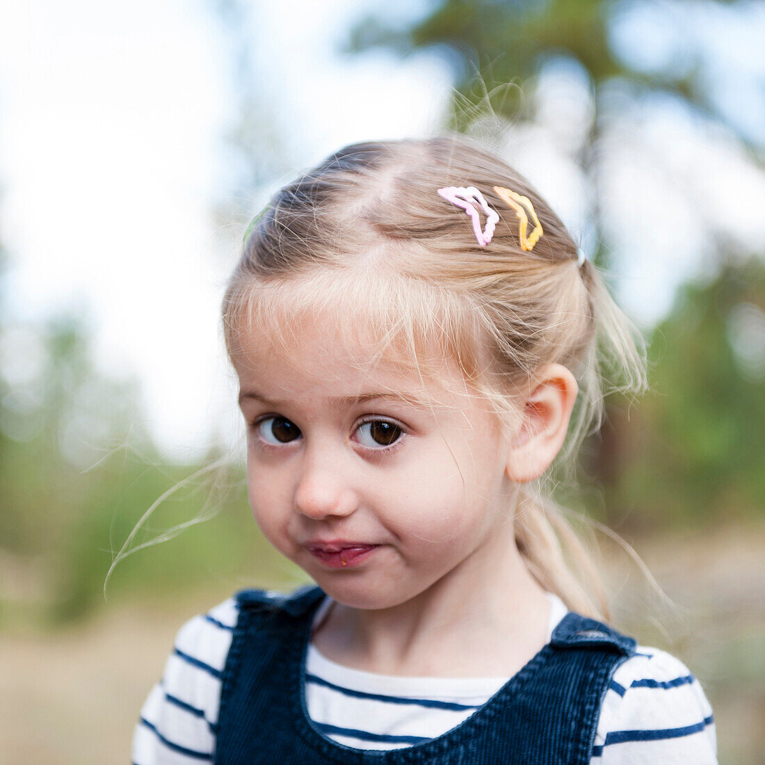 Close up of serious Caucasian girl on hillside