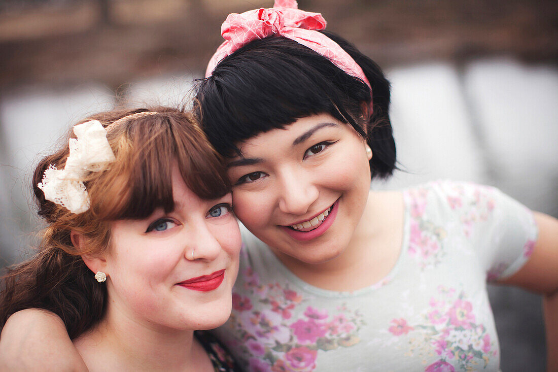 Close up of smiling women hugging