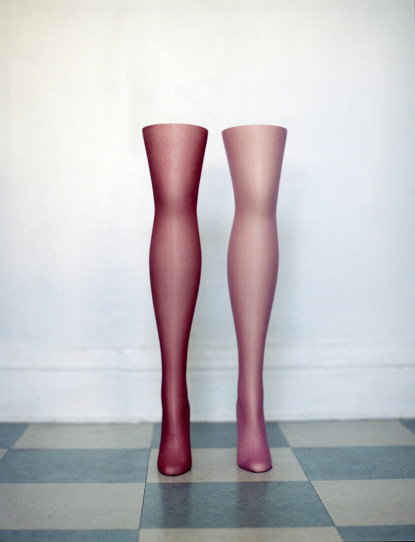 Mannequin legs standing on tiled floor