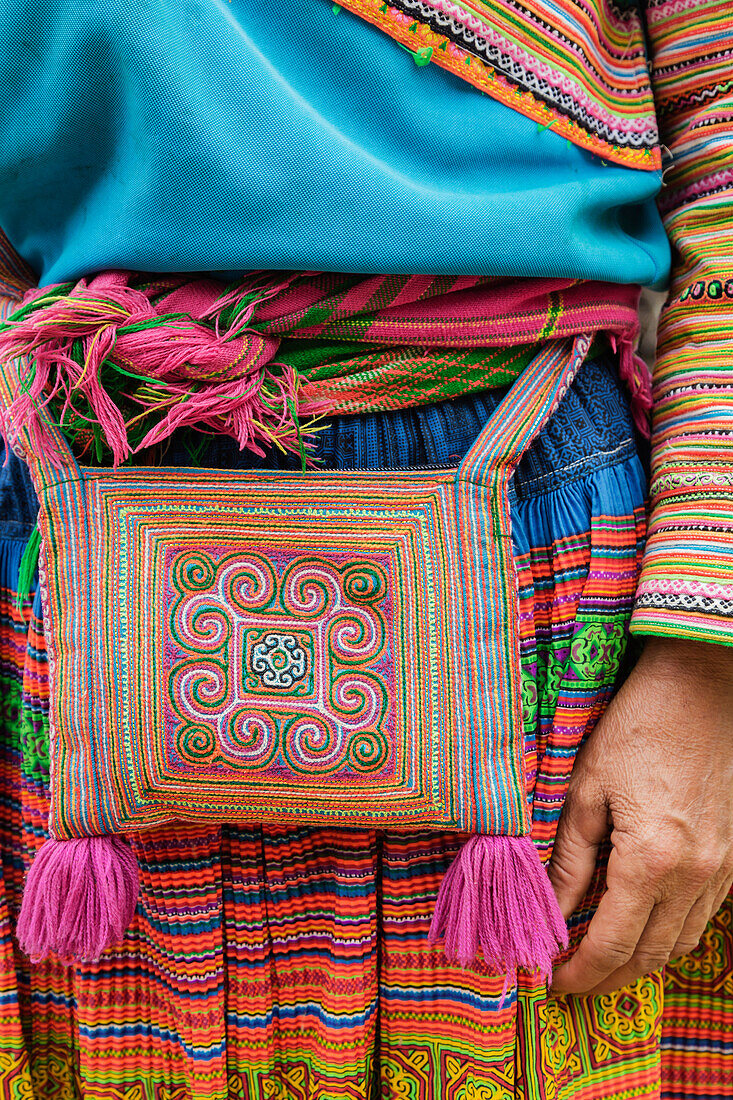 Close up of woman wearing traditional purse and dress