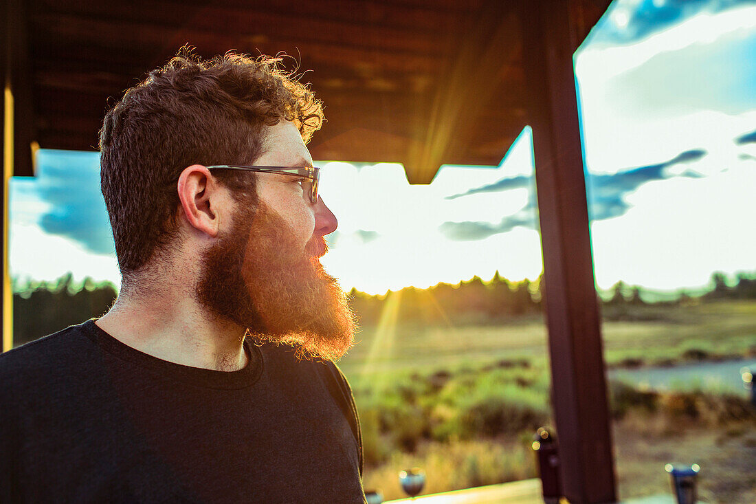 Caucasian man admiring view of remote landscape