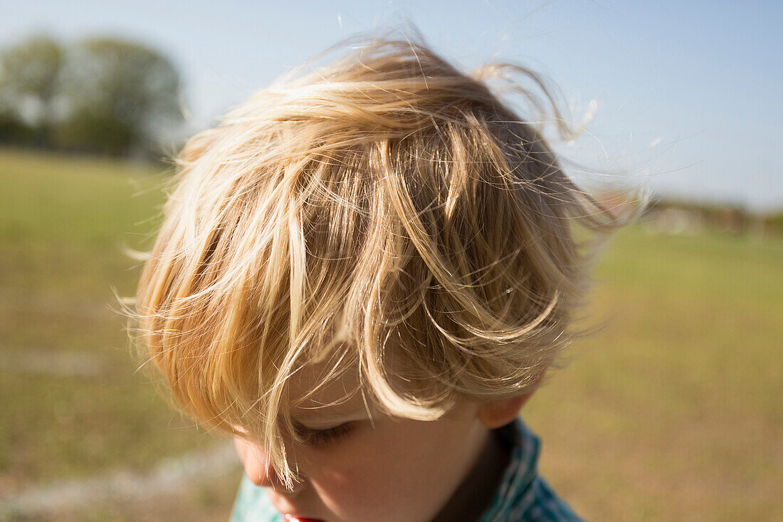 Close up of Caucasian boy in park