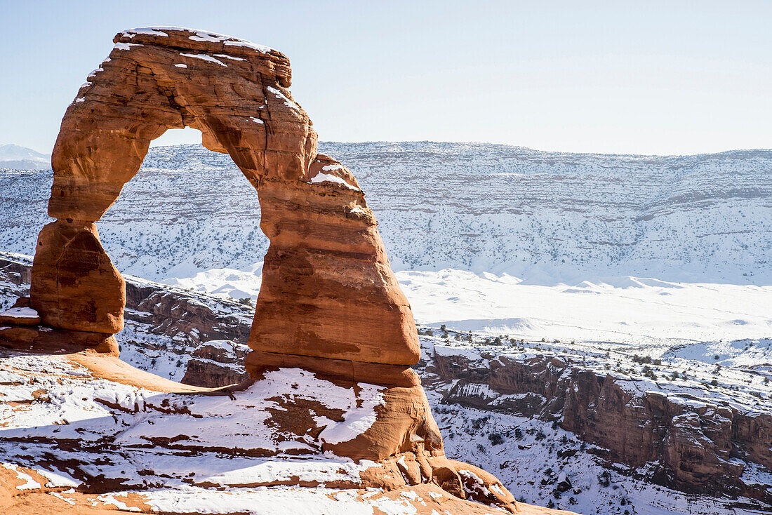 Rock formation in snowy desert park, Moab, Utah, United States