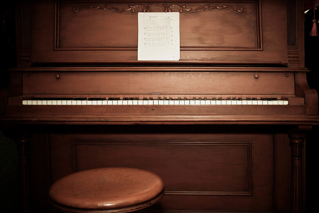 Empty piano with sheet music